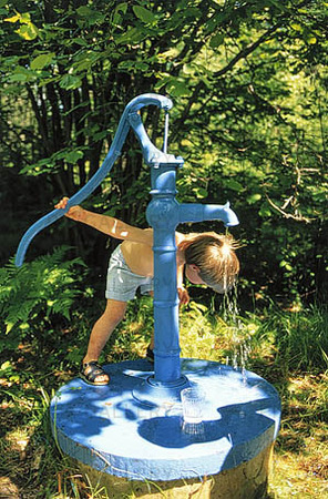 Boy at water pump