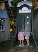 Children of older telephone kiosk