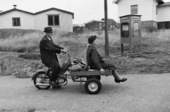 Mature couple on cargo moped