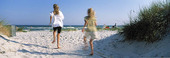 Girls running on beach