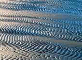 Vågmönster på sandstrand