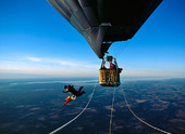 Parachute jumps from hot air balloon