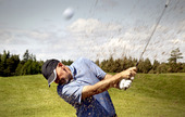 golfer shooting a golf ball 