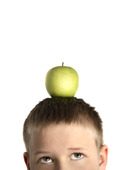 Boy with apple on head
