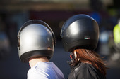 People with motorcycle helmets