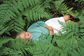 Girl among ferns