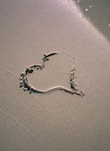 Hjärta på sandstrand
