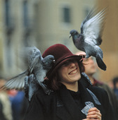 Pigeons on woman