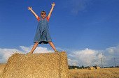 Girl on hay bales