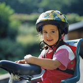 Girl with bicycle helmets