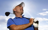 Smiling golfer holding golf club over your shoulder